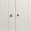Small ivory essential sphere knobs on white doors