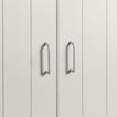 Small ivory pulls on white doors