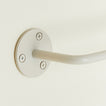 Close up of toilet paper holder in Ivory.