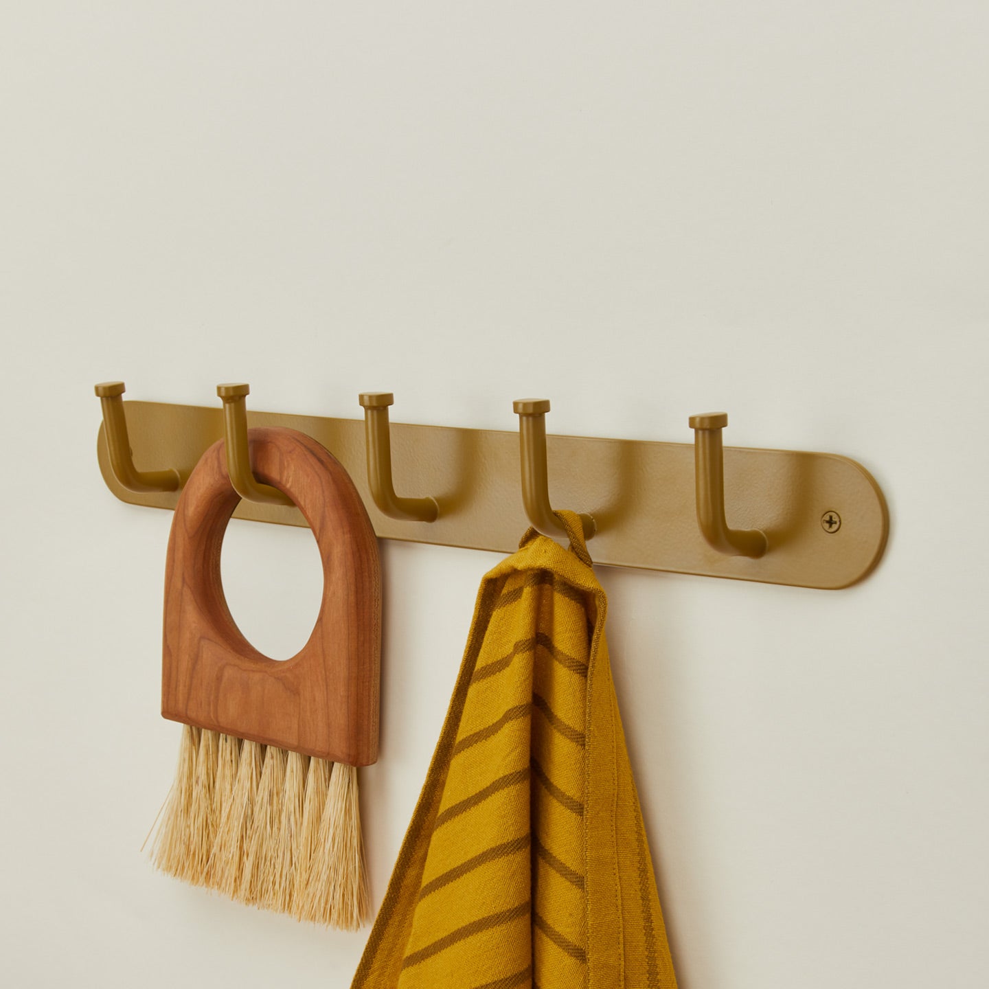 Essential hook rack in mustard with brush and kitchen towel