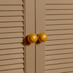 Large mustard essential sphere knobs on louvered doors