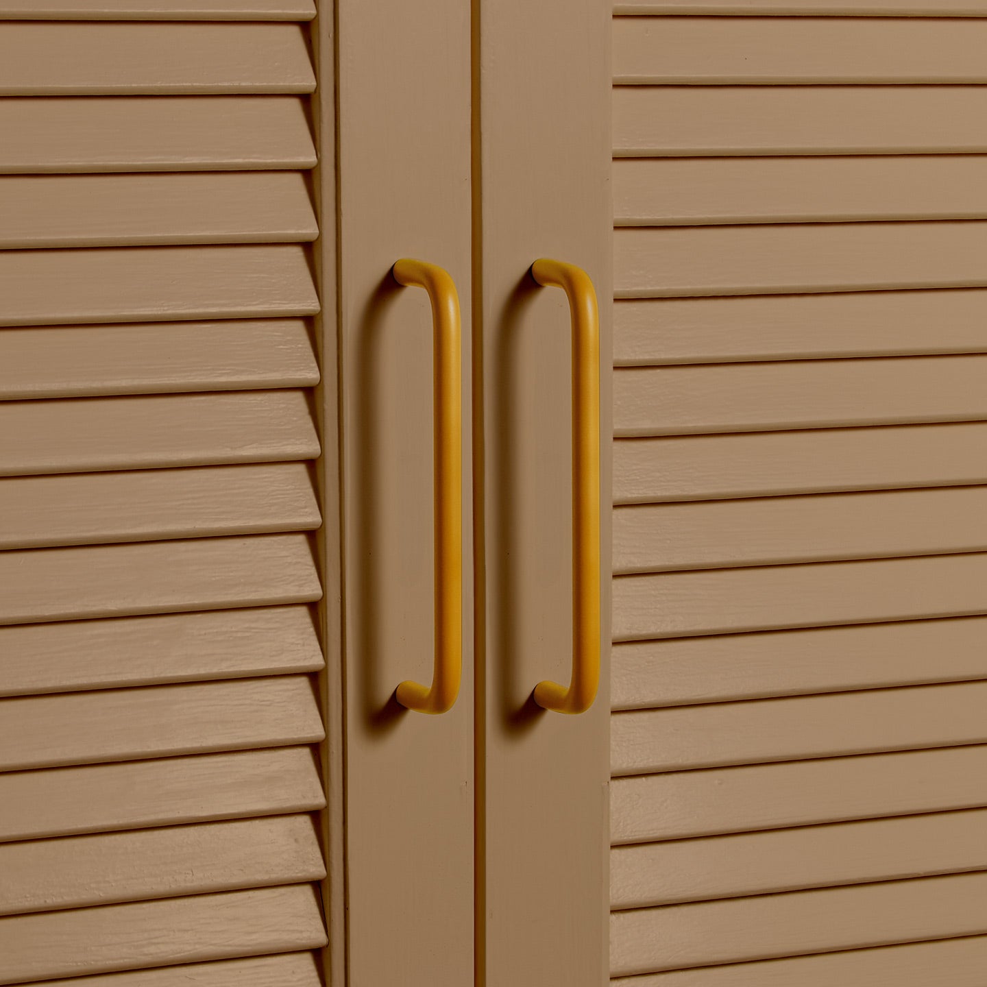 Large mustard pulls on louvered doors