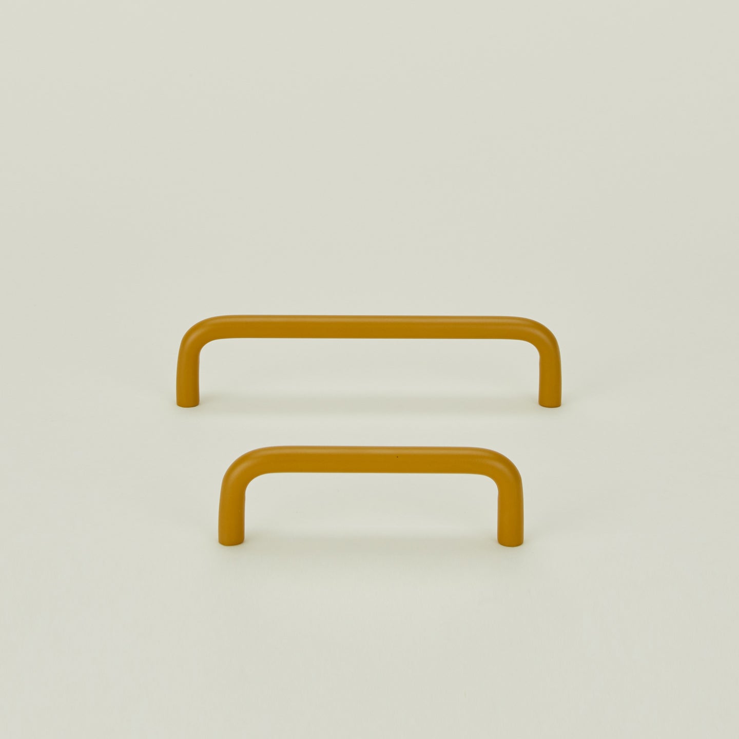 Small and large drawer pulls in Mustard.