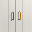 Small mustard pulls on white doors