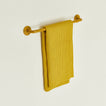 Small towel bar in Mustard with waffle dish towel.