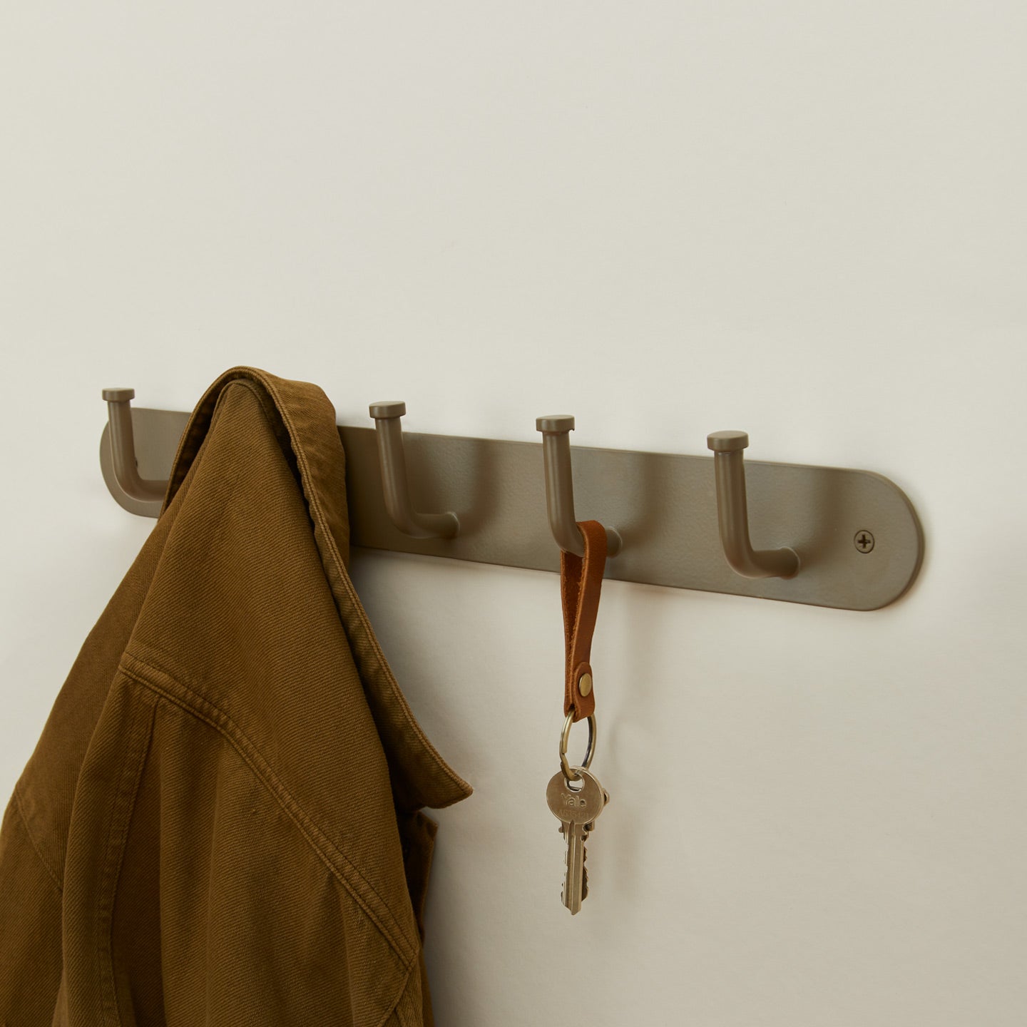 Essential hook rack in olive with coat and keys