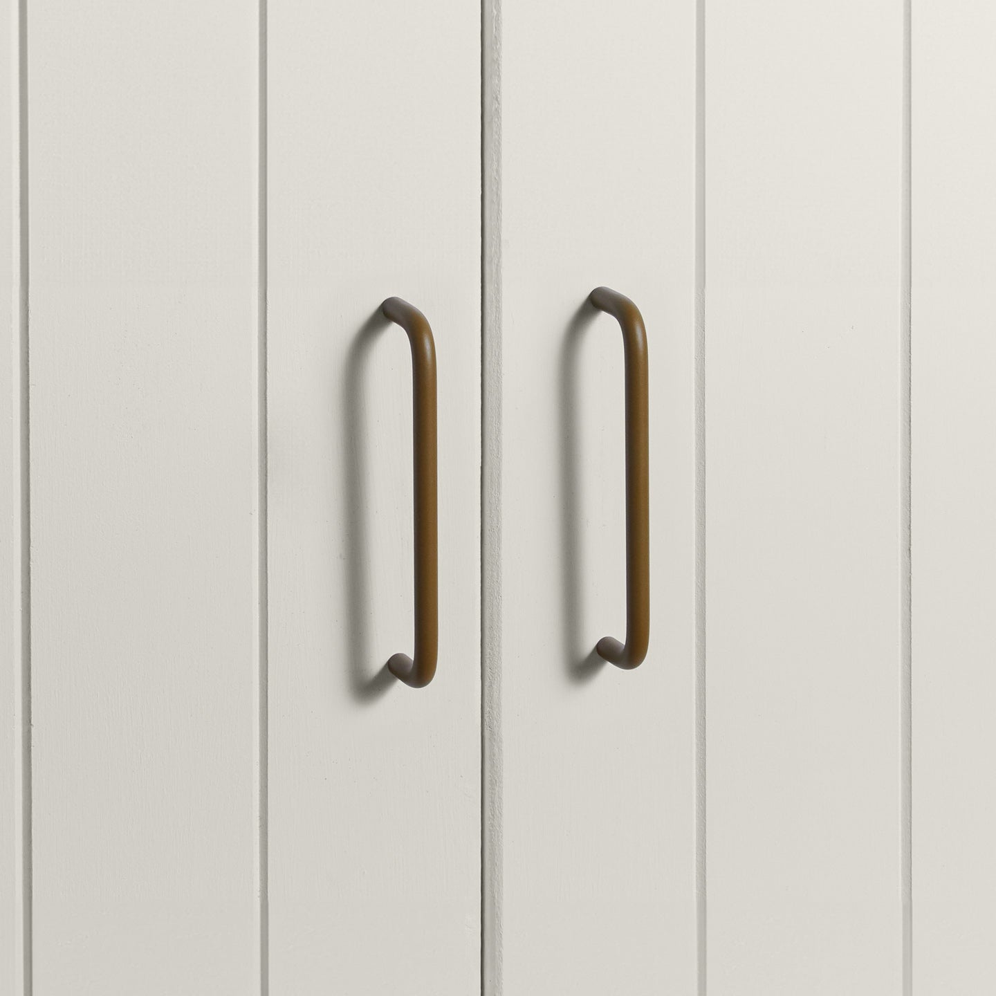 Large olive pulls on white doors