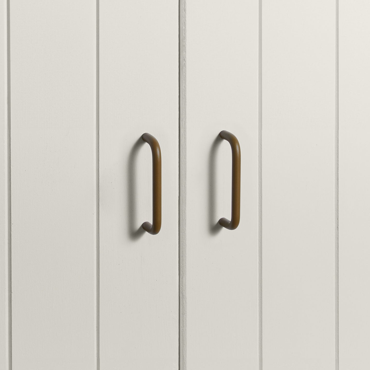 Small olive pulls on white doors