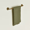 Small towel bar in Olive with waffle dish towel.