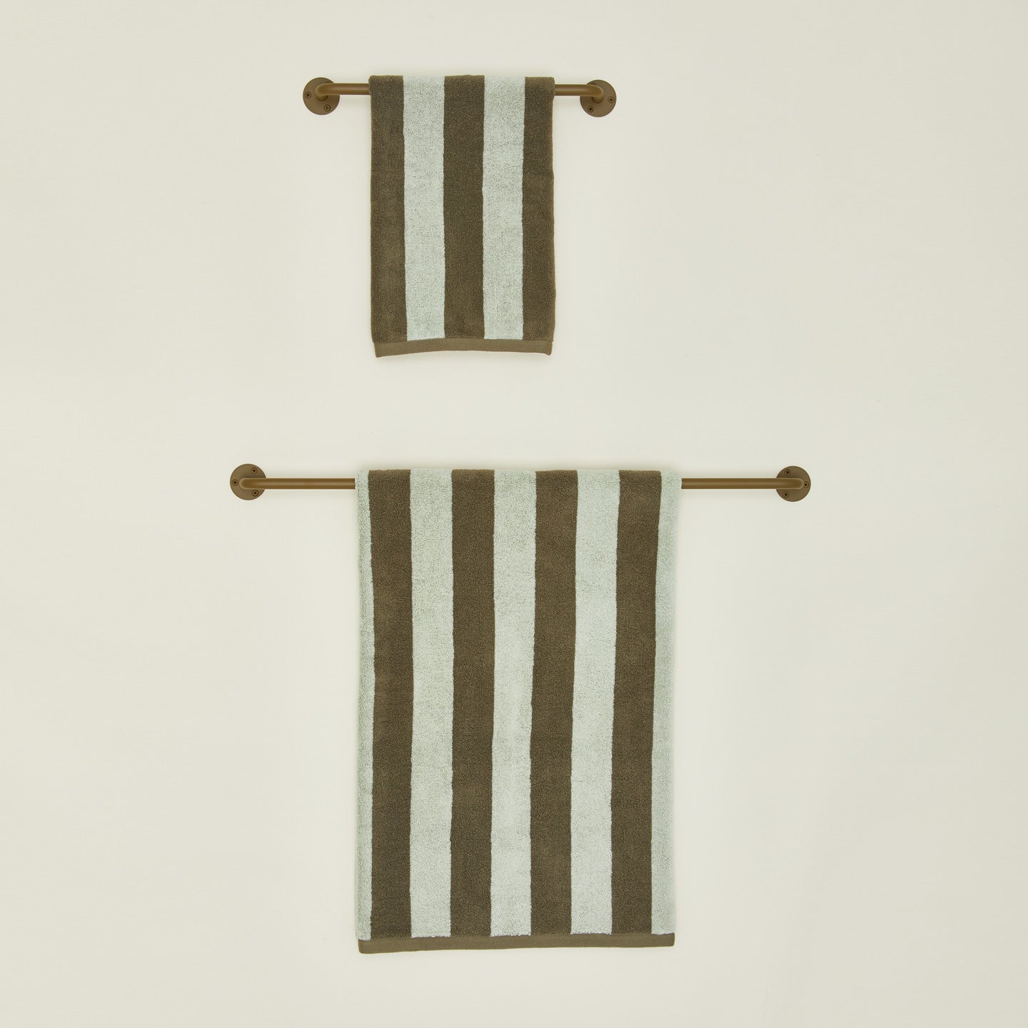 Small and large towel bars in Olive with striped towels.