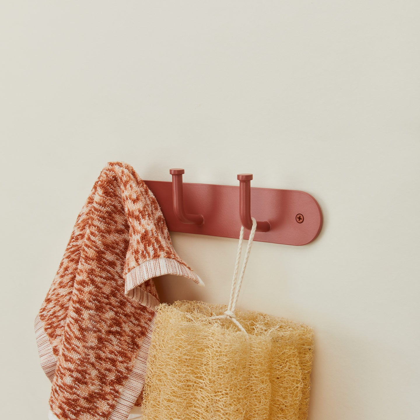 Essential hook rack in terracotta washcloth and sponge