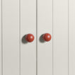 Large terracotta essential sphere knobs on white doors