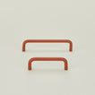 Small and large drawer pulls in Terracotta.