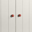 Small terracotta essential sphere knobs on white doors