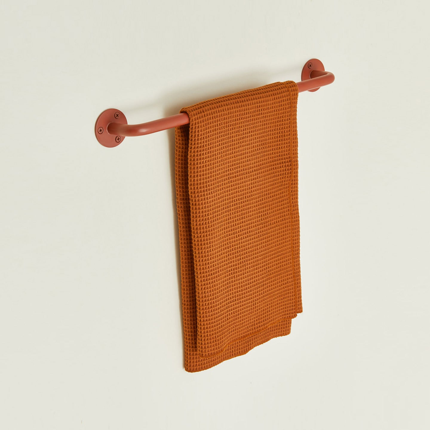 Small towel bar in Terracotta with waffle dish towel.