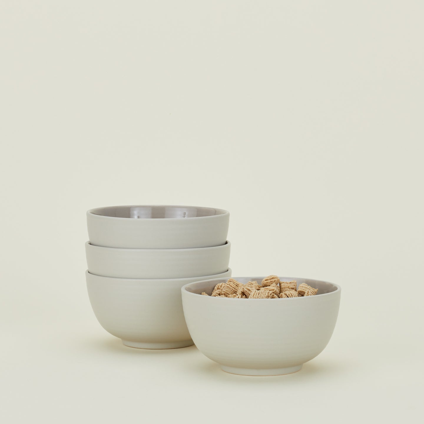 Four Essential Large Bowls in Light Grey, with cereal.