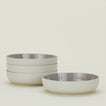 Four light grey Essential Low Bowls.