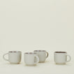 Four Essential Mugs in Light Grey, with coffee.