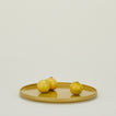 Essential Serving Platter in Mustard with fruit.