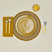 Essential Woven Placemat in mustard with place setting.
