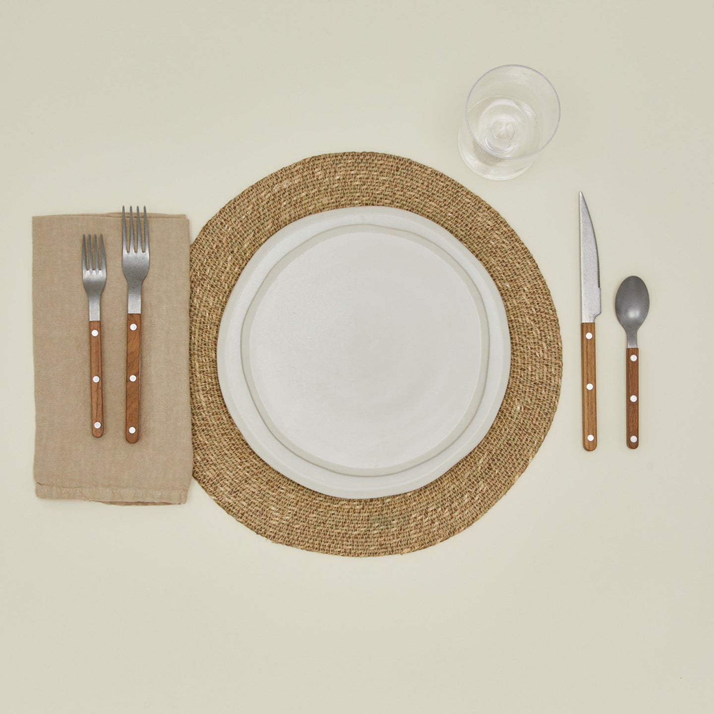 Essential woven placemat in natural with place setting