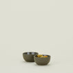 Two Essential Extra Small Bowls in Olive filled with olives.