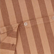 Close up view of essential striped duvet in blush/terracotta