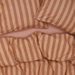 Essential Stripe Pillowcases, Set of 2 - Blush/Terracotta on bed with matching duvet