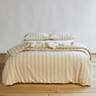 Essential Stripe Duvet - Ivory/Flax on bed with matching pillow cases