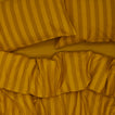 Essential Stripe Duvet - Mustard/Bronze on bed with matching pillow cases