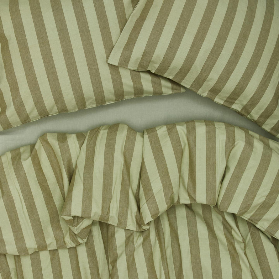 Essential Stripe Pillowcases, Set of 2 - Sage/Olive on bed with matching duvet
