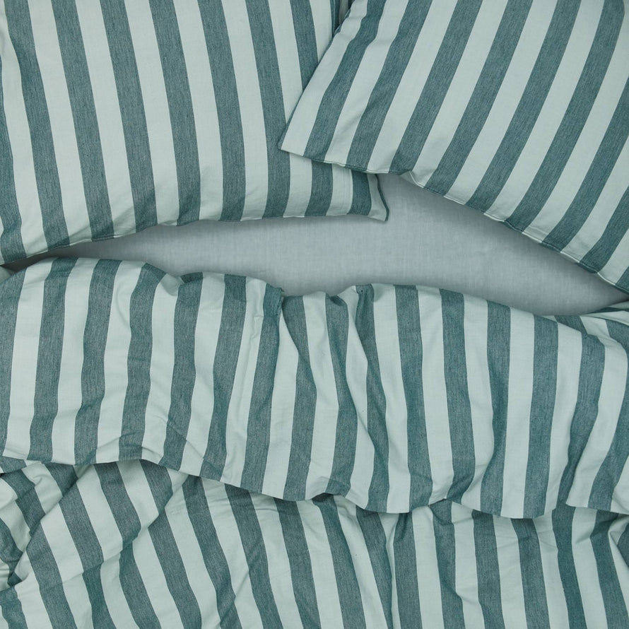 Essential Stripe Pillowcases, Set of 2 - Sky/Peacock on bed  with matching duvet