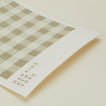Close up view of essential swedish dishcloths in ivory/flax