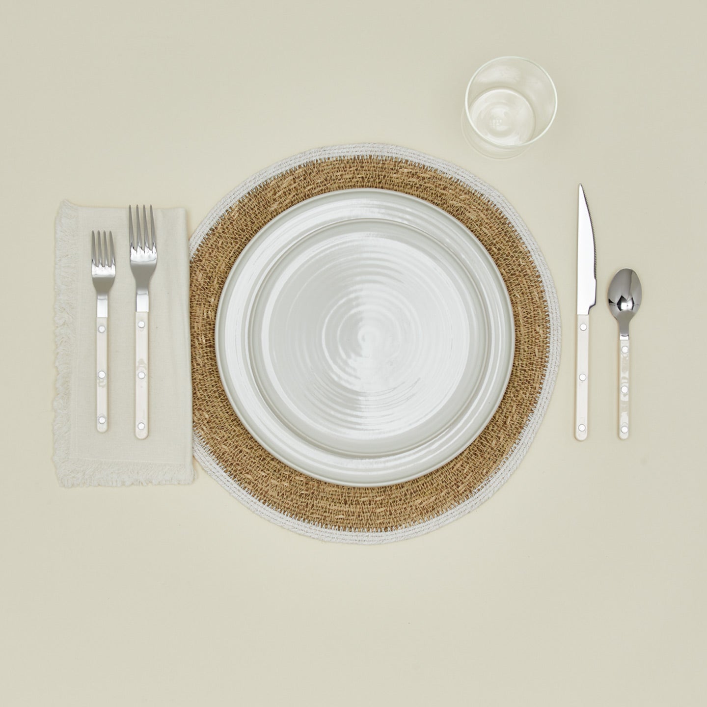 Essential woven placemat in white with place setting