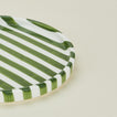 Close up view of Fodory olive striped dinner plate