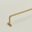 Close up view brass towel bar mounting flange