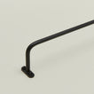 Close up view of iron towel bar mounting flange