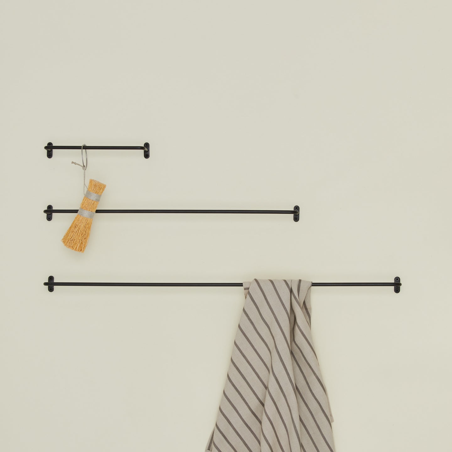 Iron towel bar family in black with brush and hand towel
