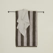 Large iron towel bar with striped terry towel and waffle hand towel