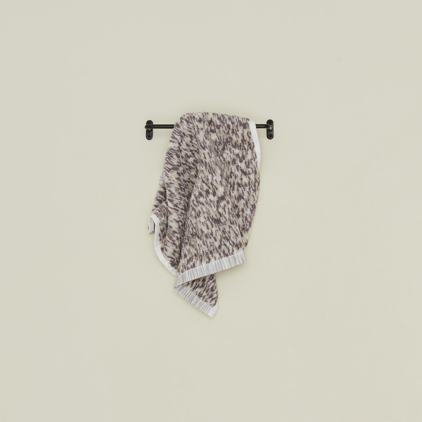 Small iron towel bar with space dye washcloth