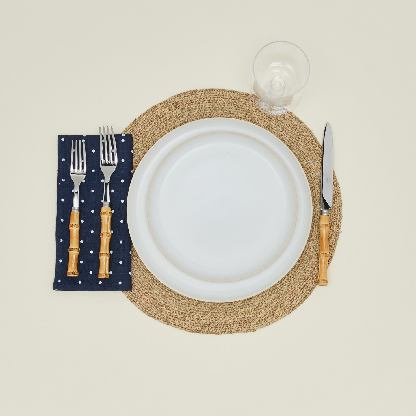 Dot linen napkin in navy and white with place setting