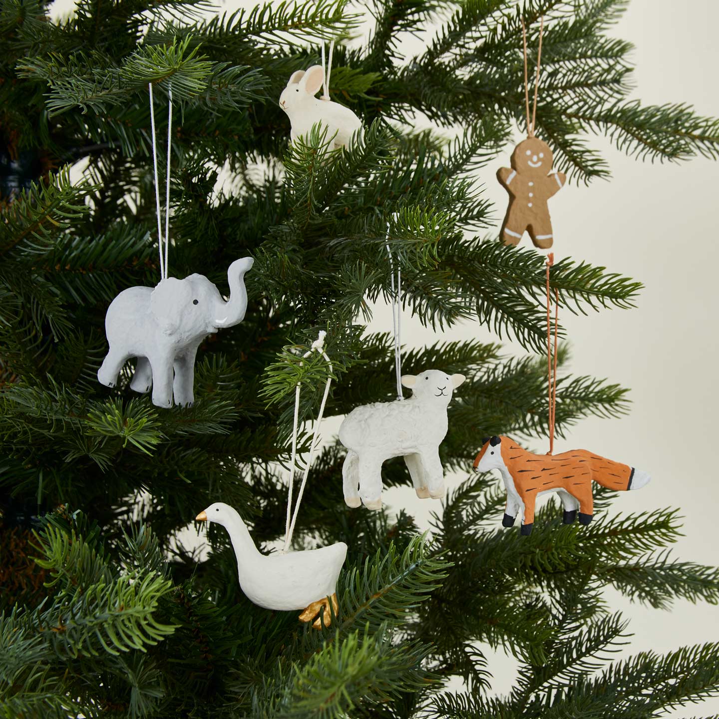 Paper mache ornaments on tree