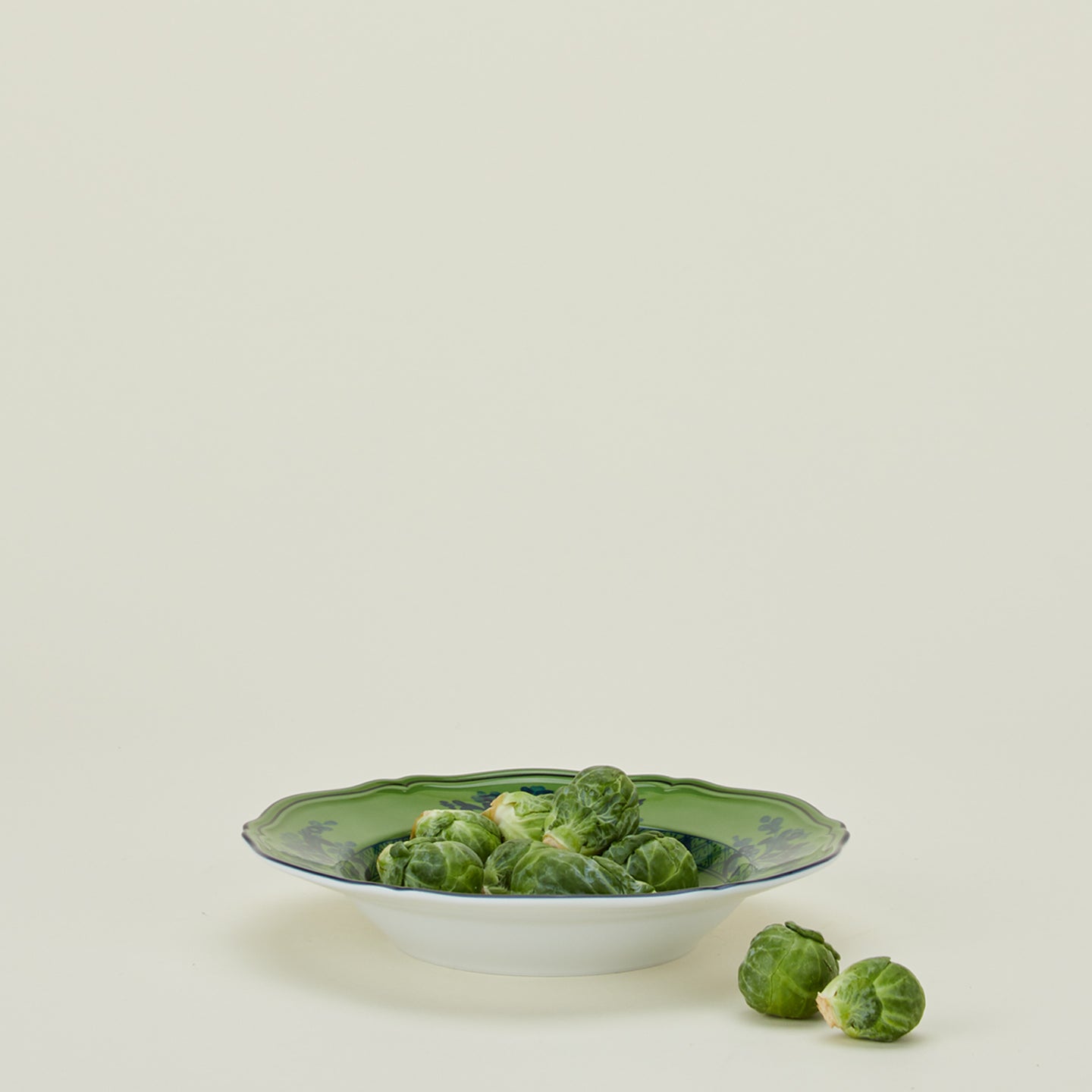 Ginori soup plate in malachite with brussels sprouts