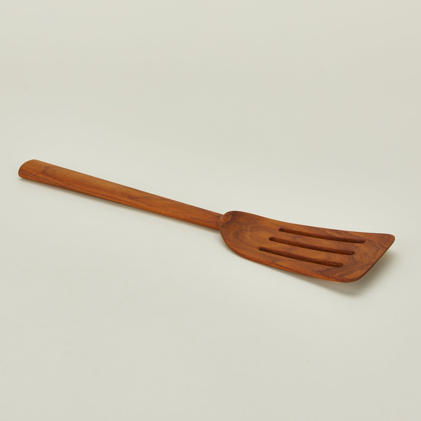 Detailed view of Wide Teak Slotted Spatula