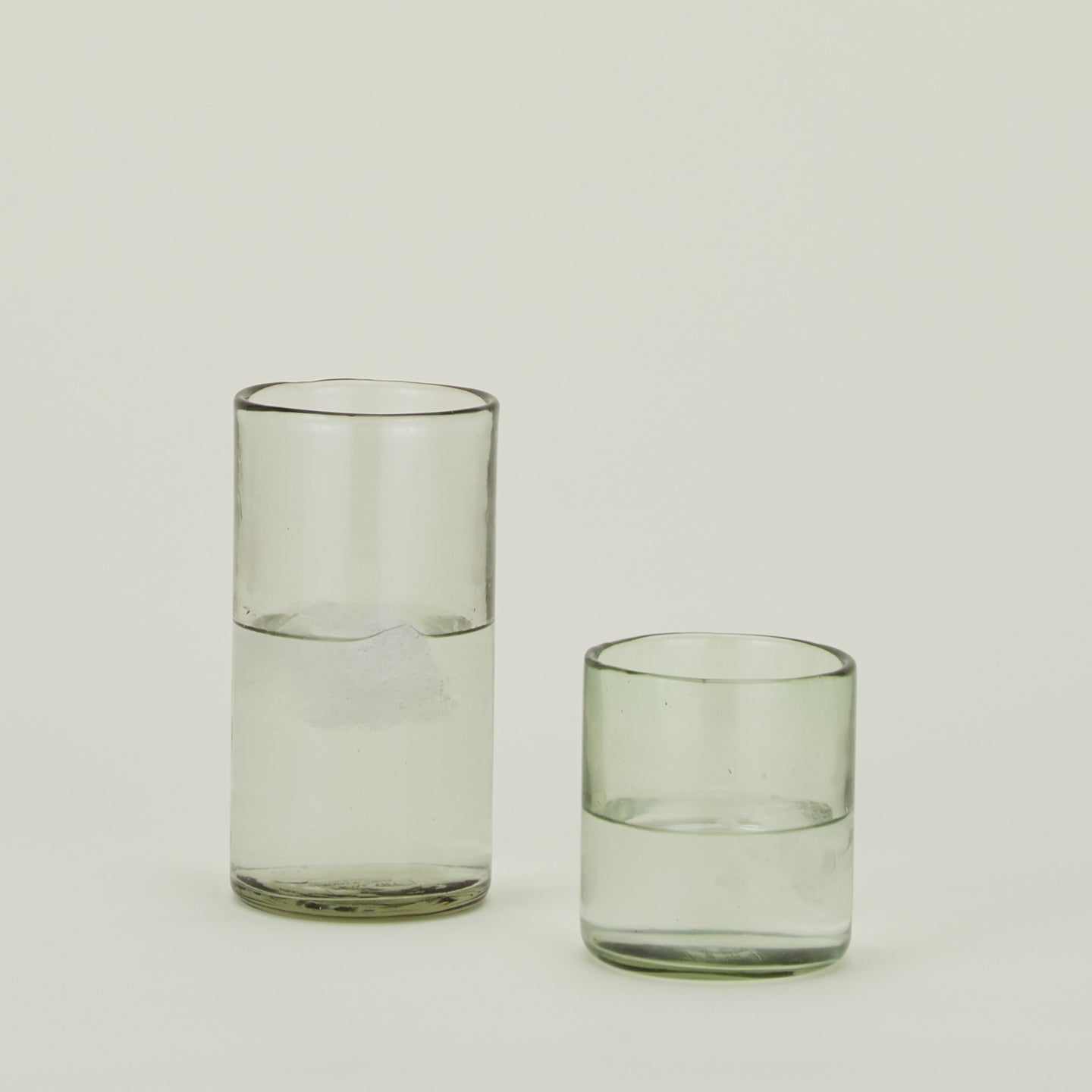 Two Recycled Cantina Tumbers in various sizes, filled with water.