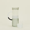 Tequila Sunrise Jug in Smoke along with a drinking glass.