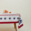 Inner Child celestial tablecloth on table with bowl of oranges.
