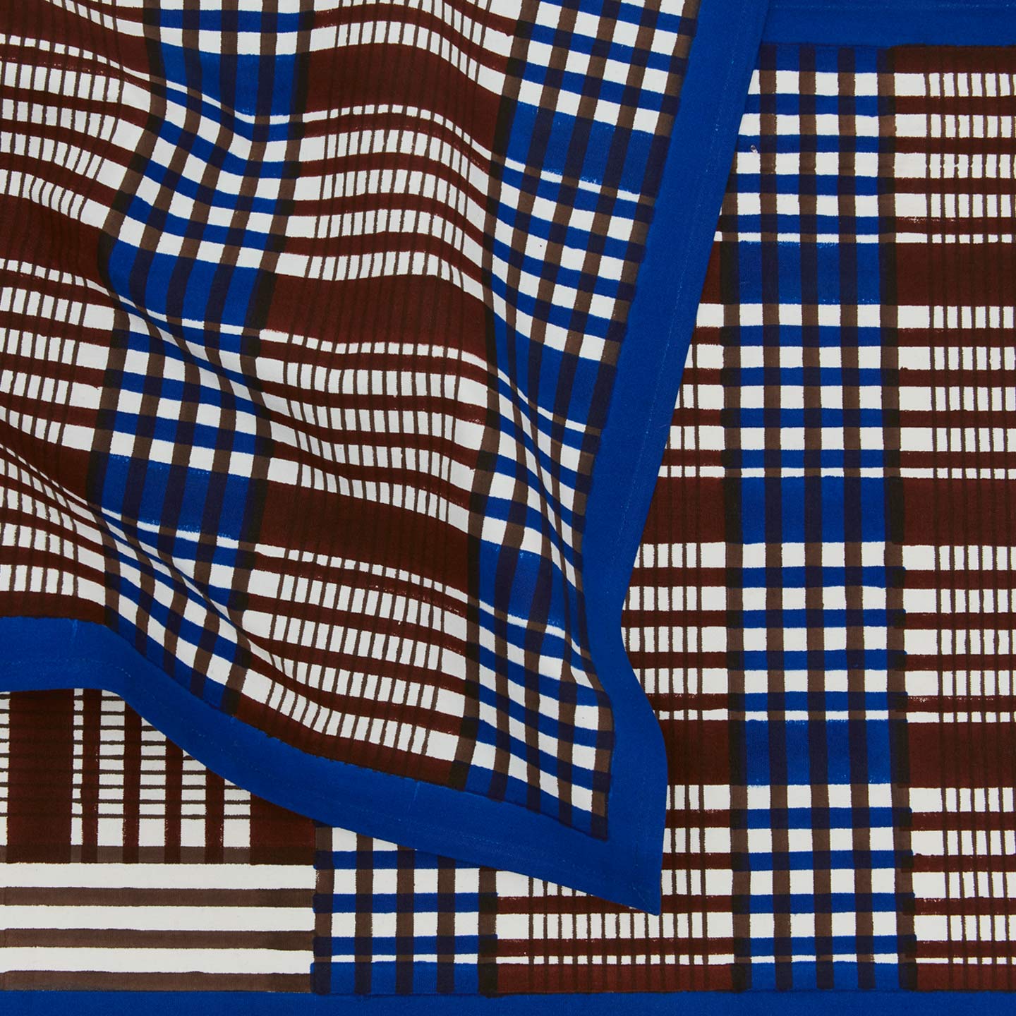 Close up view of Inner Child Shetland plaid table runner