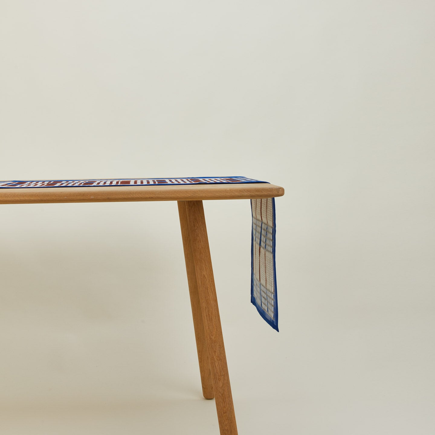 Inner Child Shetland plaid table runner on table.
