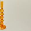 Close up view of Disk candle holder in amber